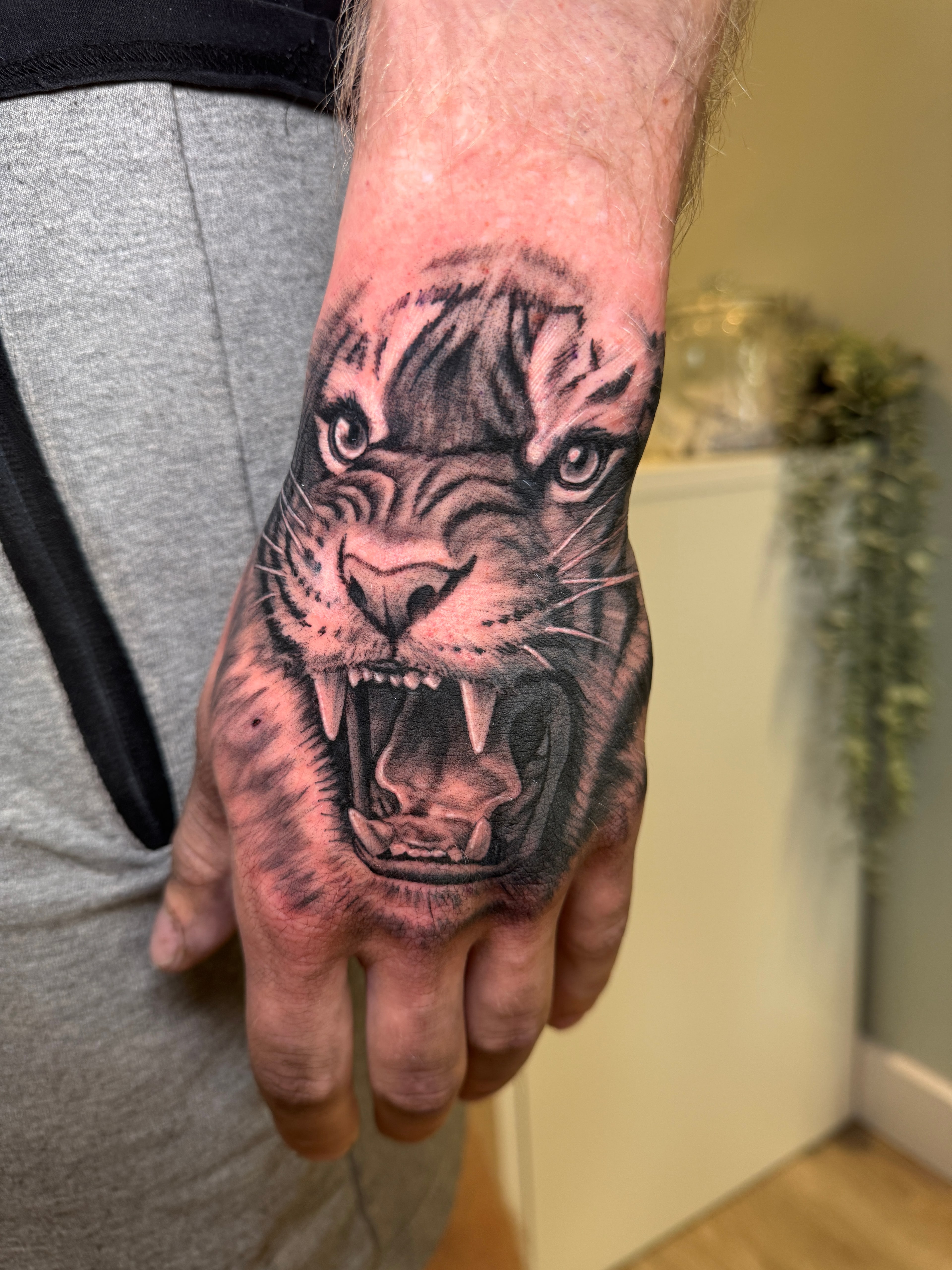 Black and grey tiger tattoo